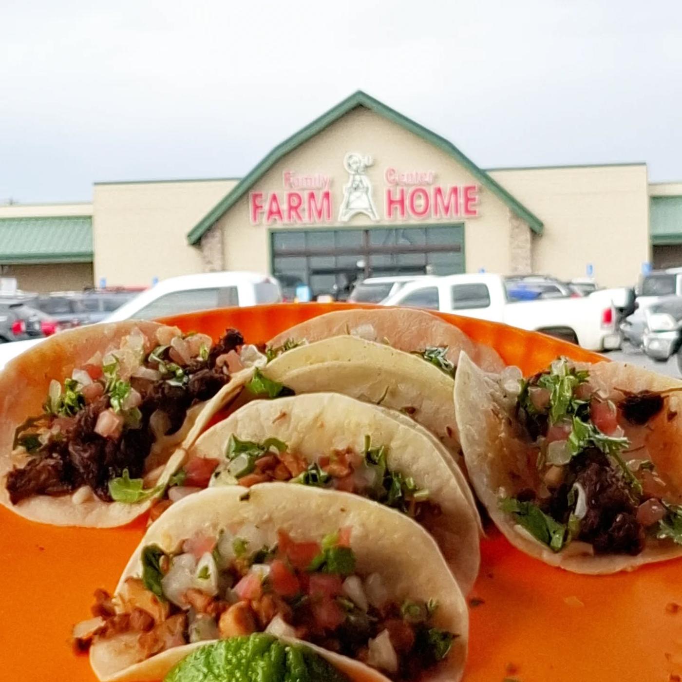 Three tacos on an orange plate