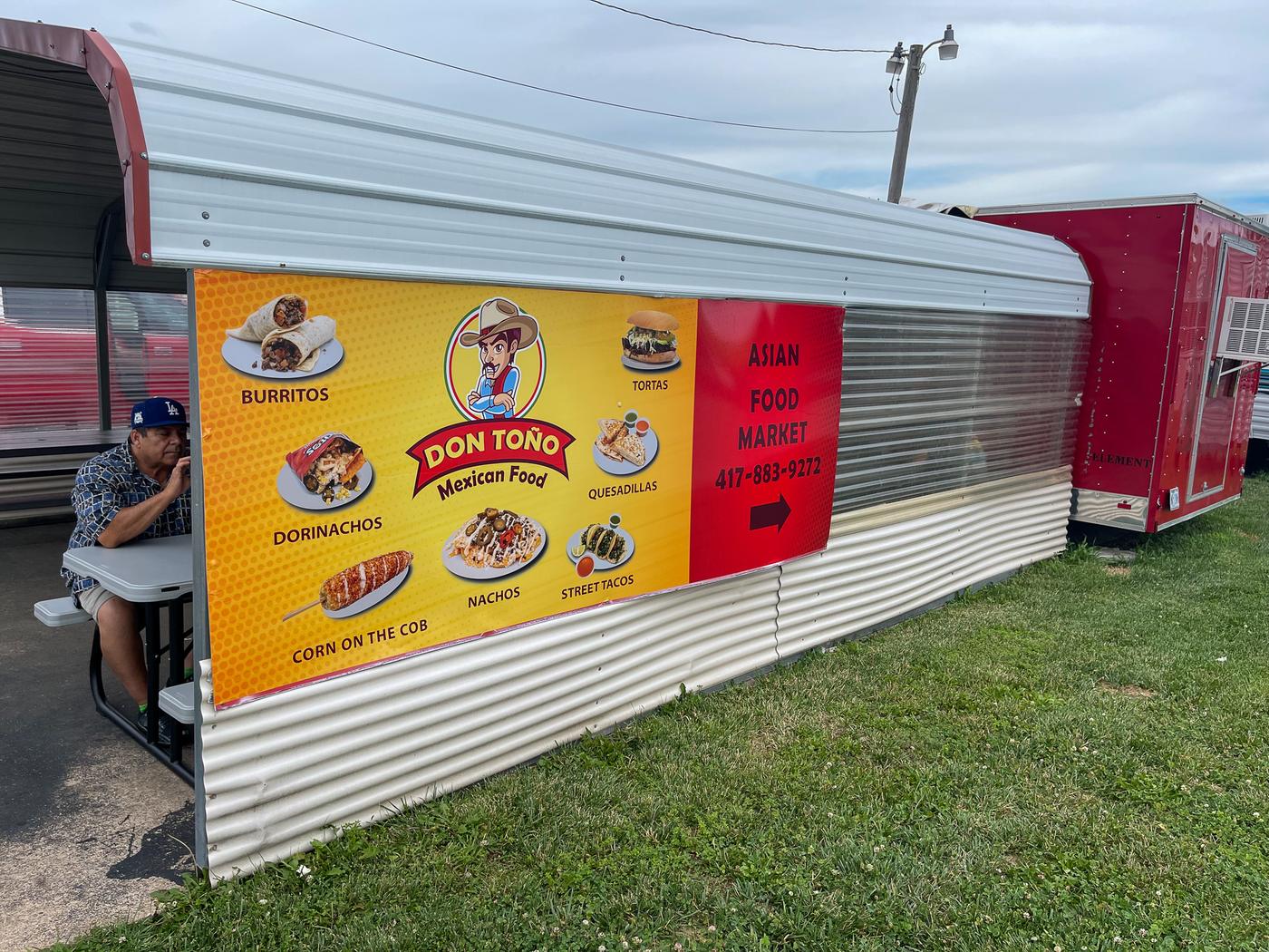 The Don Toño truck with its menu banner along the side